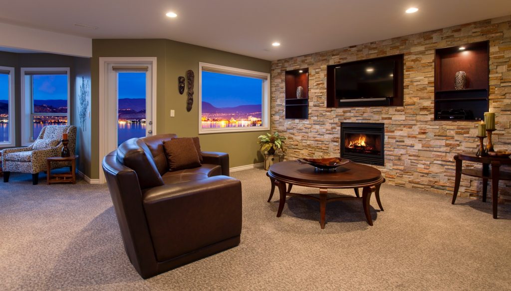 Interior Design Kelowna - Living room with stone feature wall